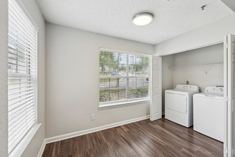 A laundry room with a washer and dryer.