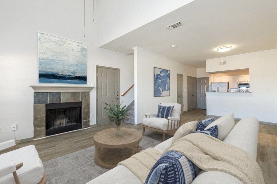 a living room with a fireplace and a couch