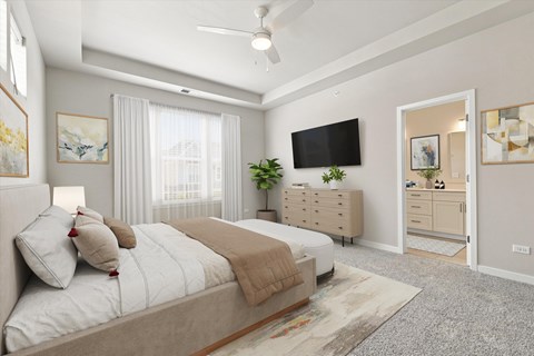 A bedroom with a large bed, a flat screen TV, and a dresser with a mirror.