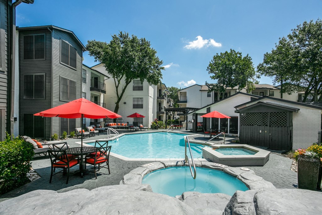 our apartments have a swimming pool and patio with umbrellas