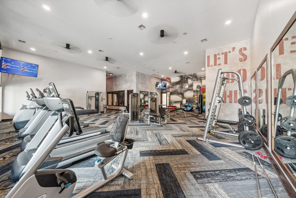 a gym with weights and other exercise equipments and a sign that reads left s