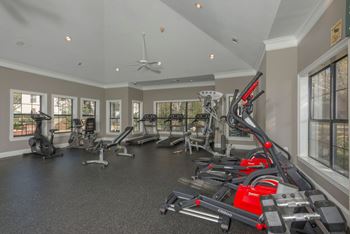 A spacious home gym with a variety of exercise equipment.
