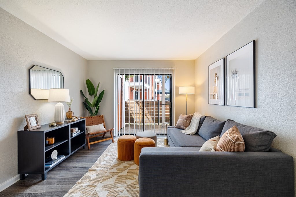 our apartments offer a living room with a couch and a tv