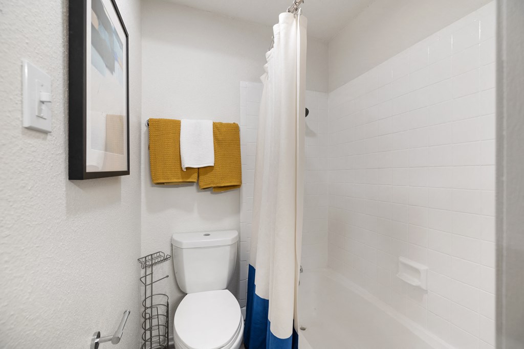 a small bathroom with a shower and a toilet