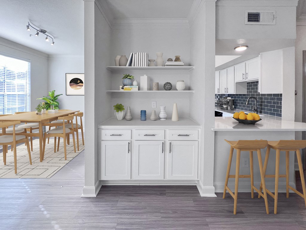 a kitchen and dining area with a table and chairs