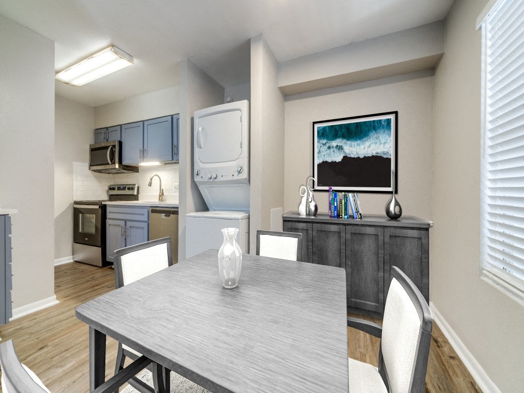 a kitchen and dining room with a table and chairs