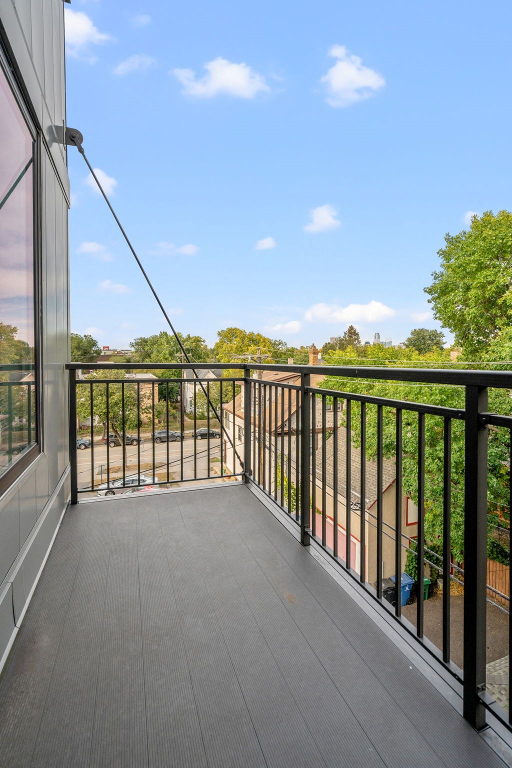 the view from the balcony of a home with a balcony guard rail