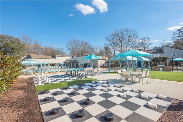 a giant chess board in the middle of a park