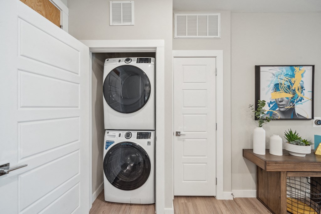 a front loading washer and dryer in a laundry room