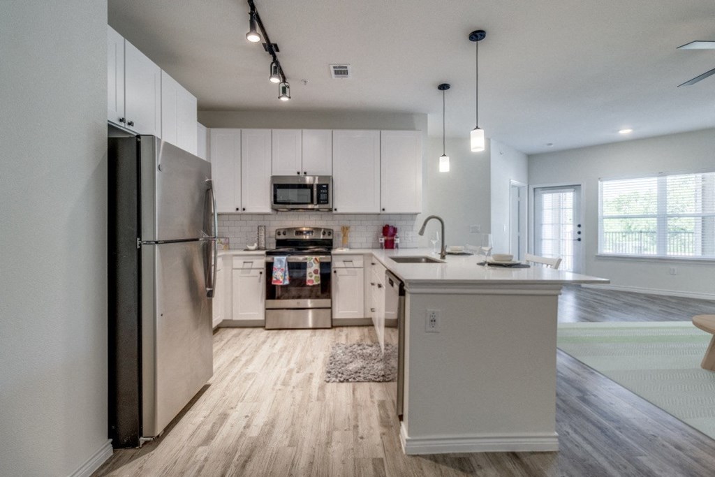 the preserve at ballantyne commons apartment kitchen with stainless steel appliances