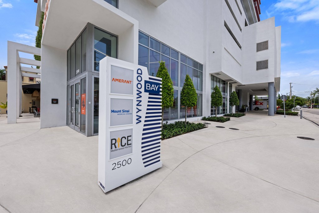 a large white sign in front of a building