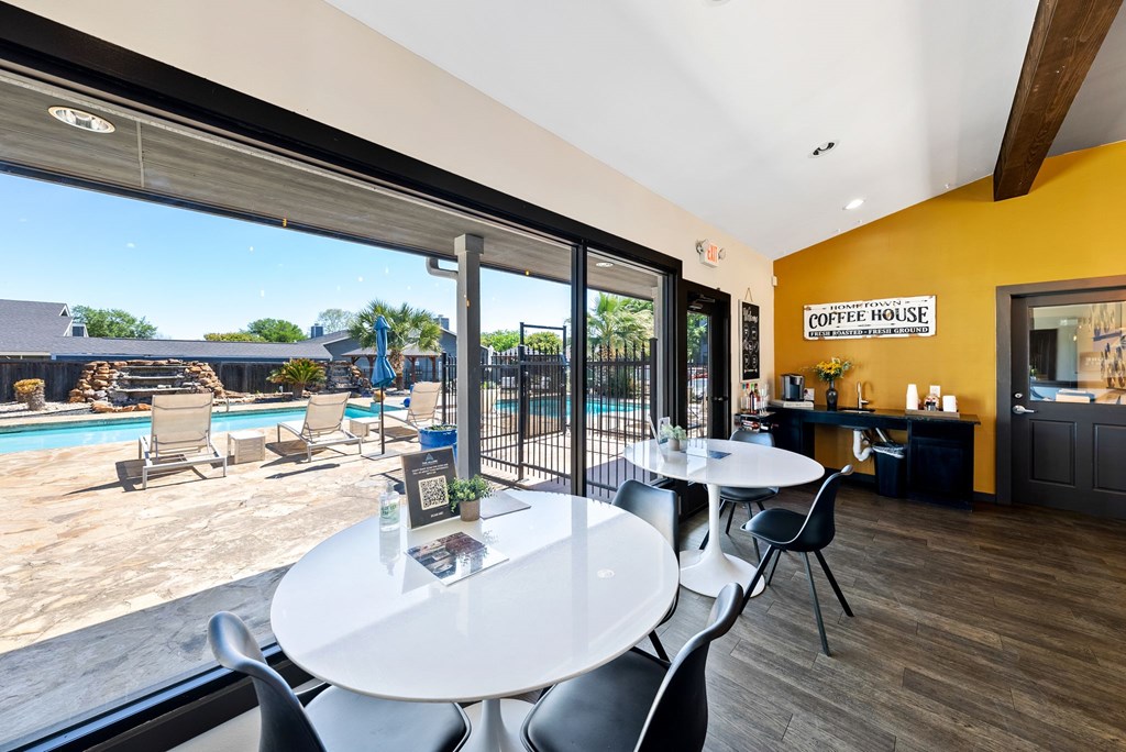 A coffee house with a pool in the back.