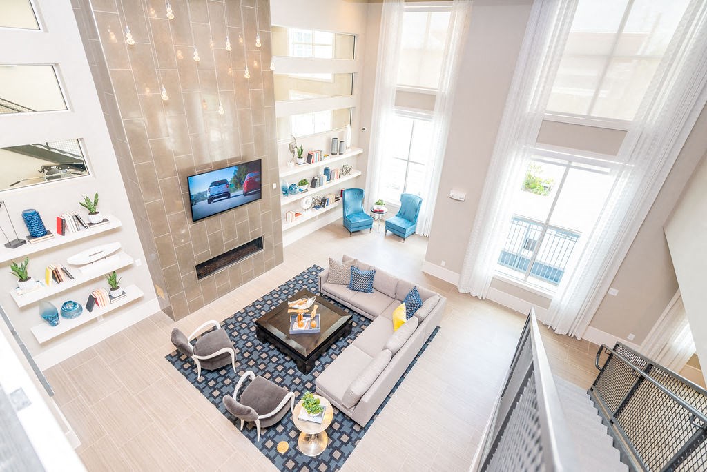 a living room with a couch and a table and a fireplace