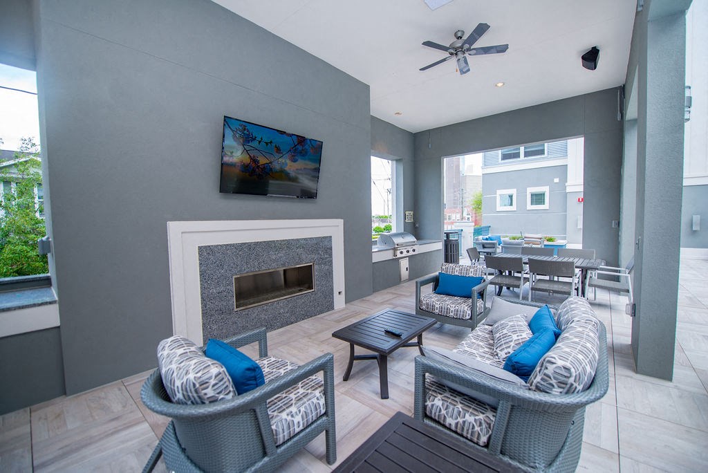 a living room with couches and chairs and a fireplace