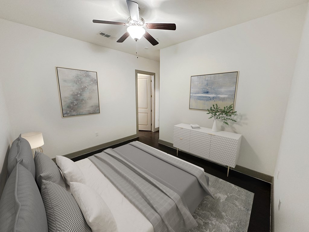 a white bedroom with a bed and a ceiling fan