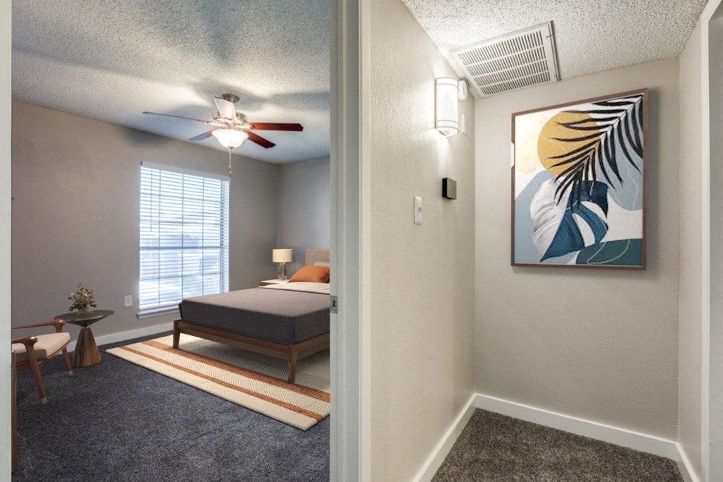 an open bedroom with a bed and a ceiling fan