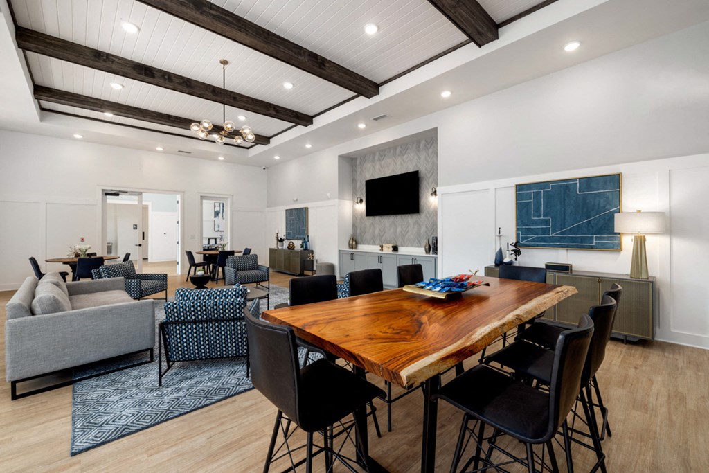 a living room with a dining room table and a couch
