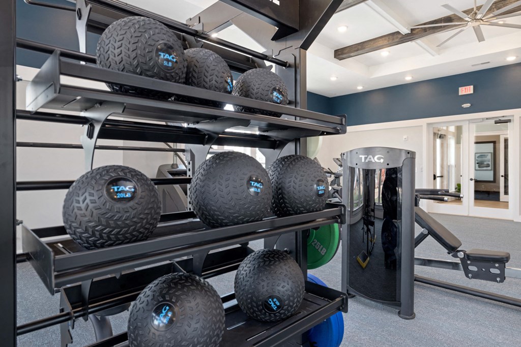 a rack of tires in a gym with an exercise machine