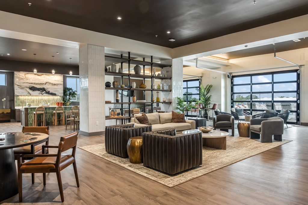 A modern living room with a wooden floor and furniture.