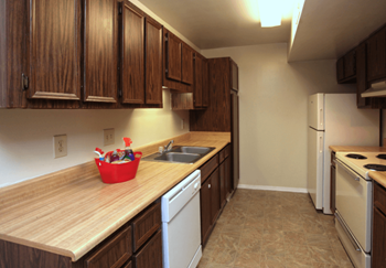 a kitchen with a wooden counter top and a sink
