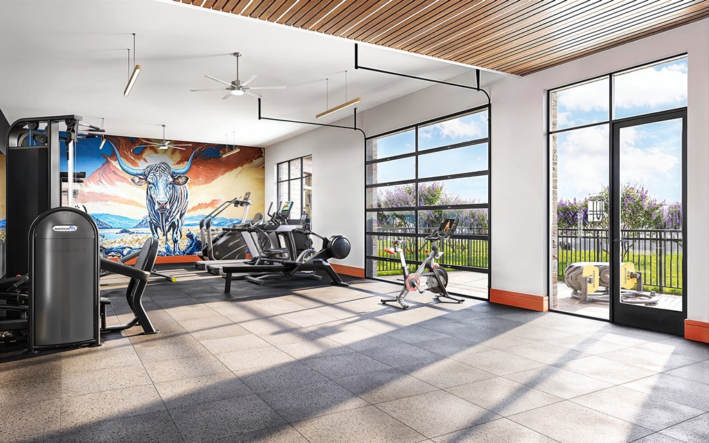 A gym with a treadmill, weights, and exercise equipment.