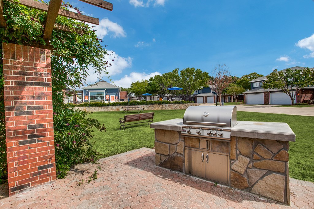 the preserve at ballantyne commons outdoor kitchen with grill and grass