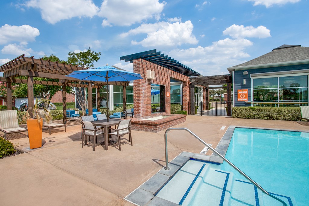 the preserve at ballantyne commons pool and patio with tables and umbrellas