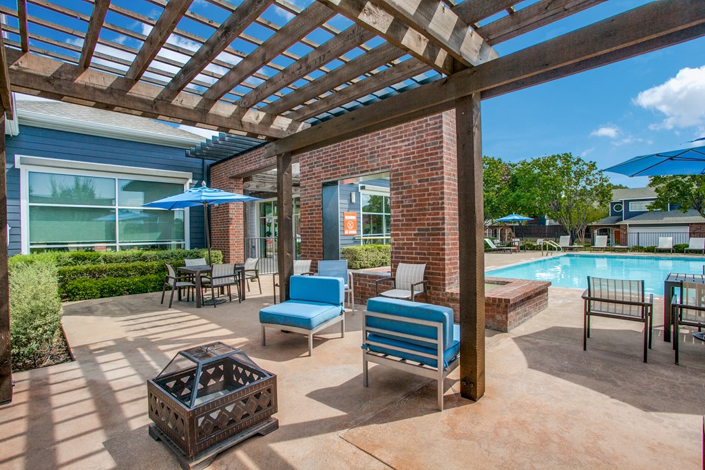 the preserve at ballantyne commons pool area with patio furniture and umbrellas