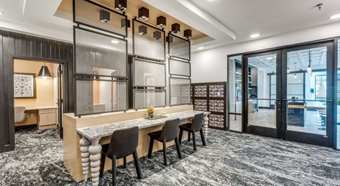 A modern dining area with a long table and chairs.