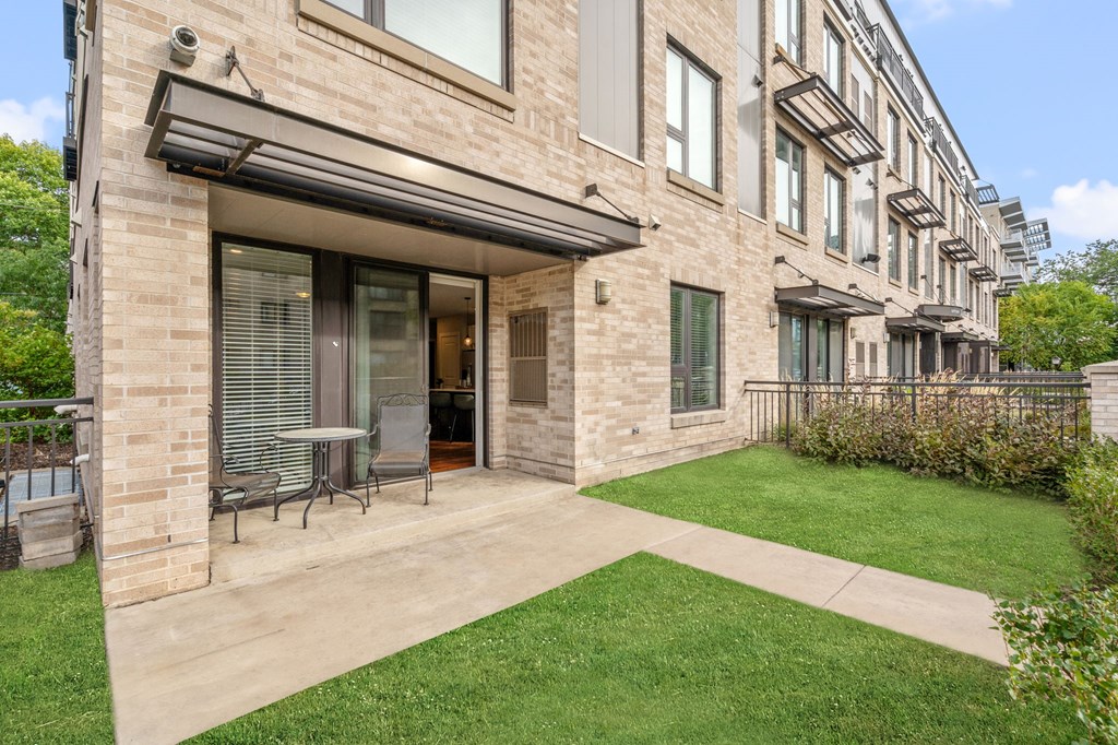 A building with a patio and a table.