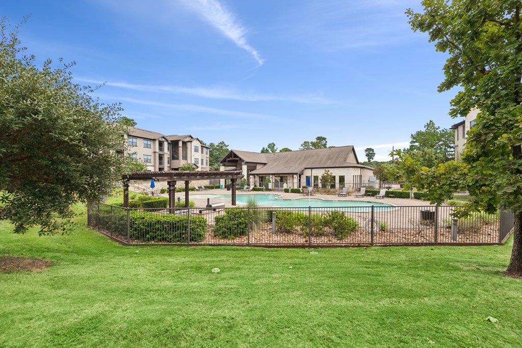 A large house with a pool in the backyard.