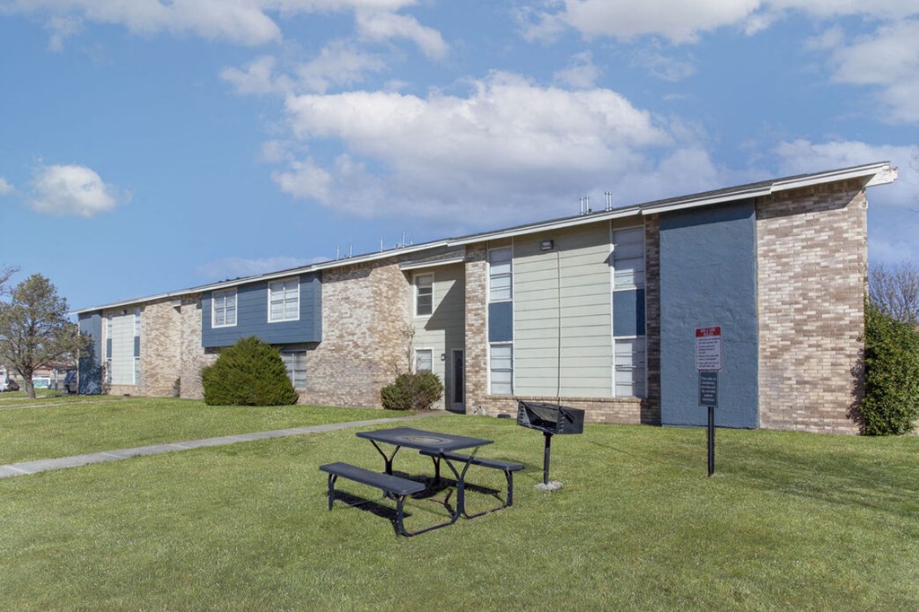 a building with a picnic table in front of it