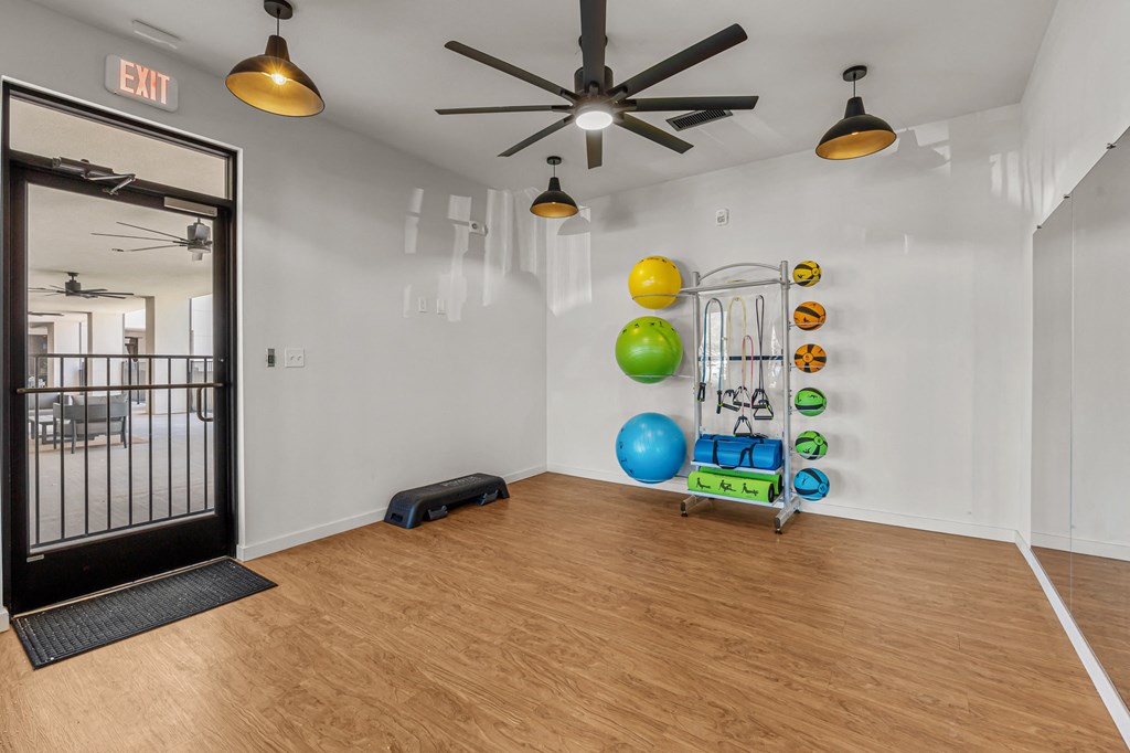 the preserve at ballantyne commons fitness room with exercise equipment and a ceiling fan