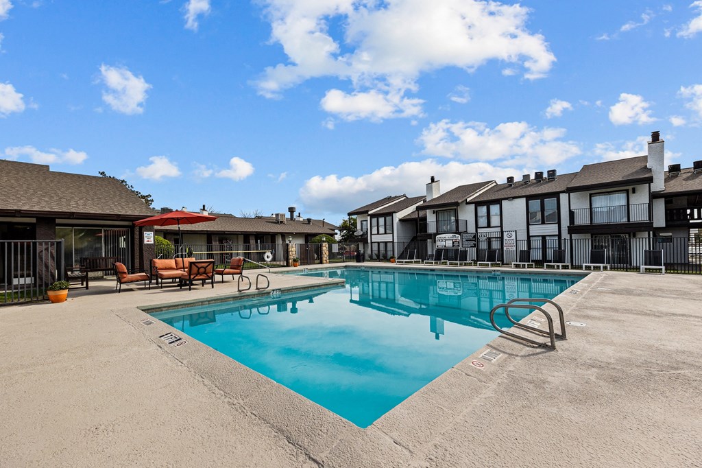 the swimming pool at the falls at rolland park apartments