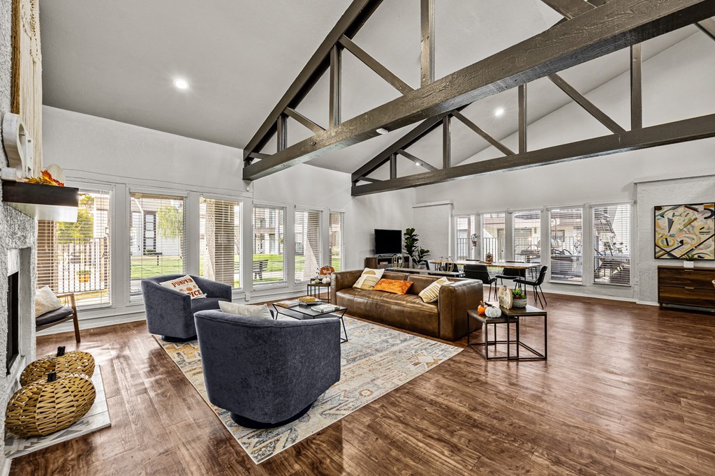 a living room with couches and chairs and a fireplace
