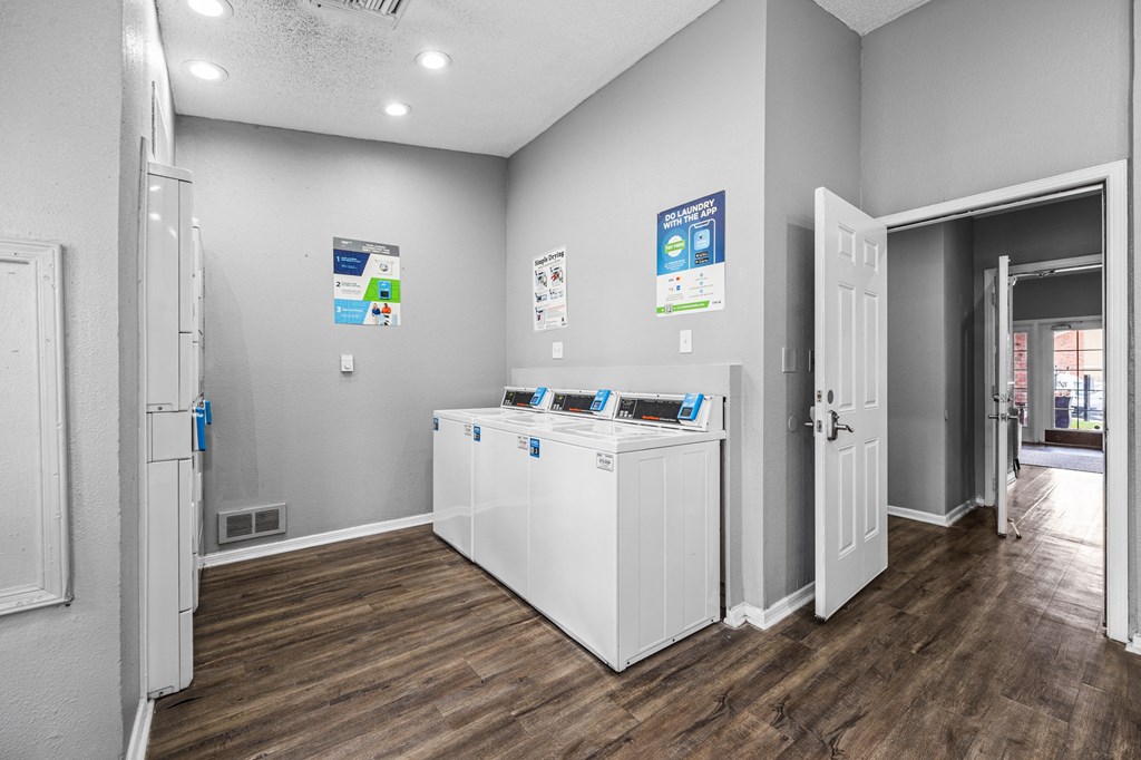 a laundry room with a washer and dryer    and a door