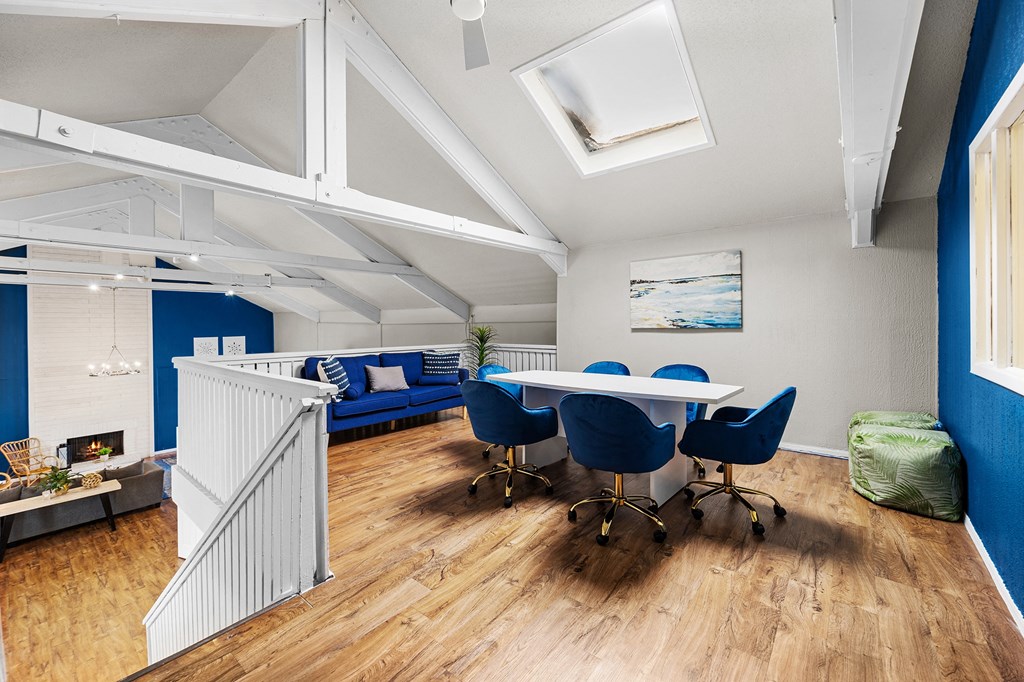 a dining room with a table and chairs