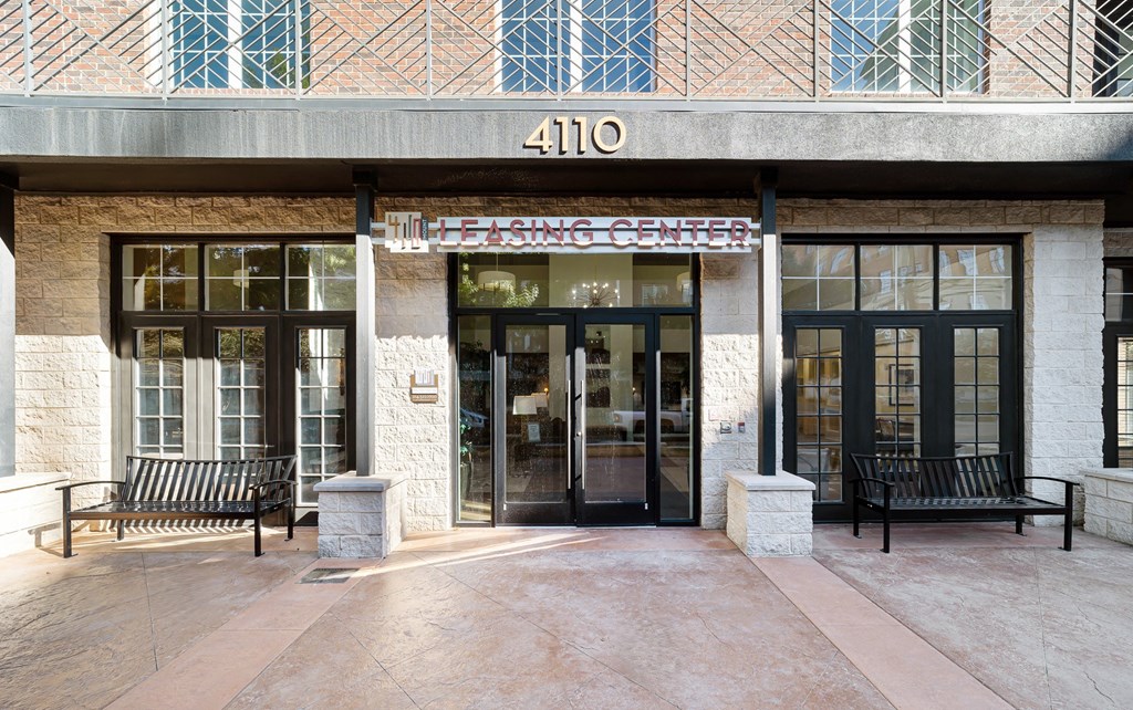 the front of a building with two doors and a sign that reads 410