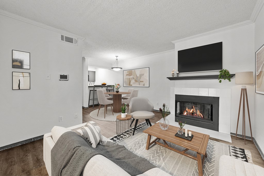 A living room with a fireplace and a couch.