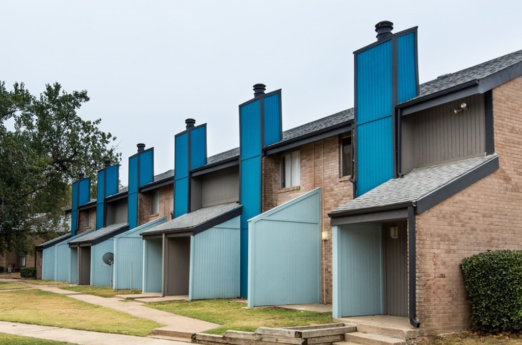 a row of houses with blue doors