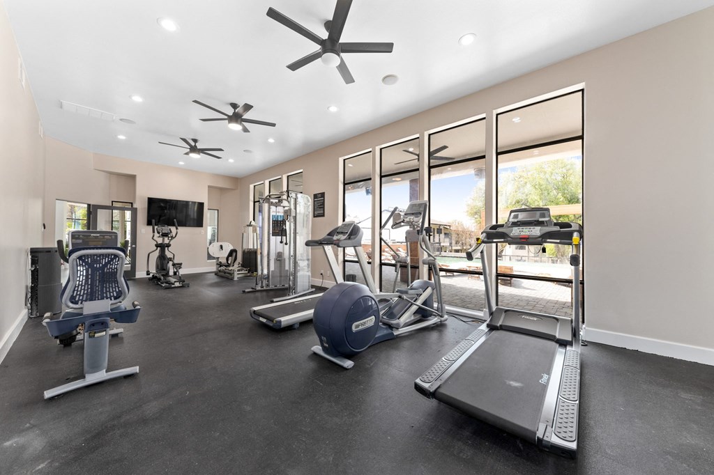a gym with treadmills and other exercise equipment