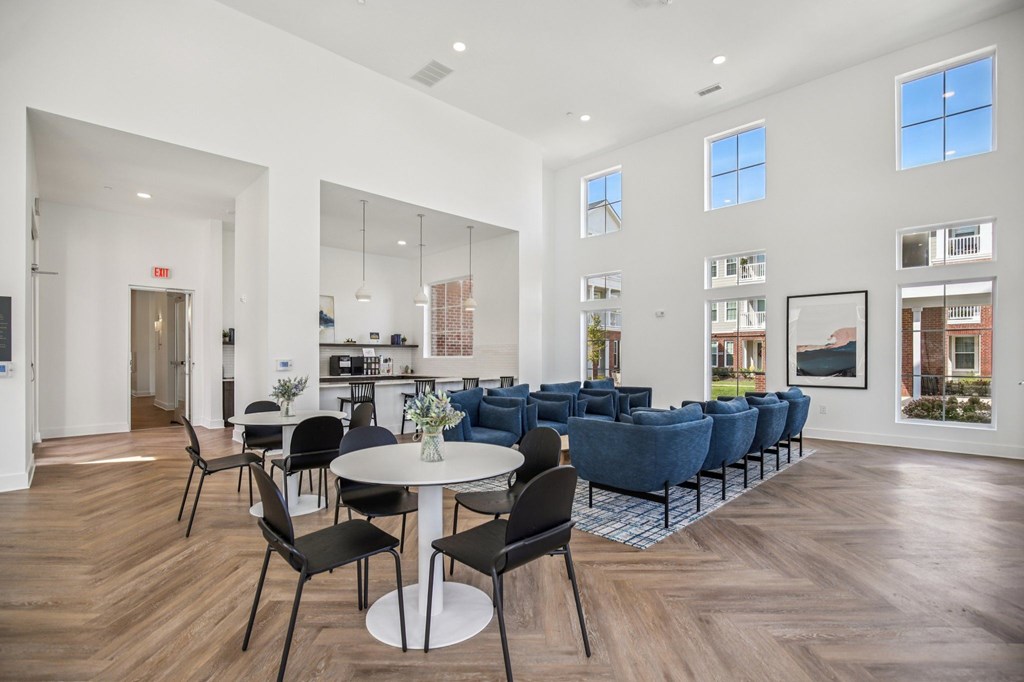 A large open space with a dining table and chairs.