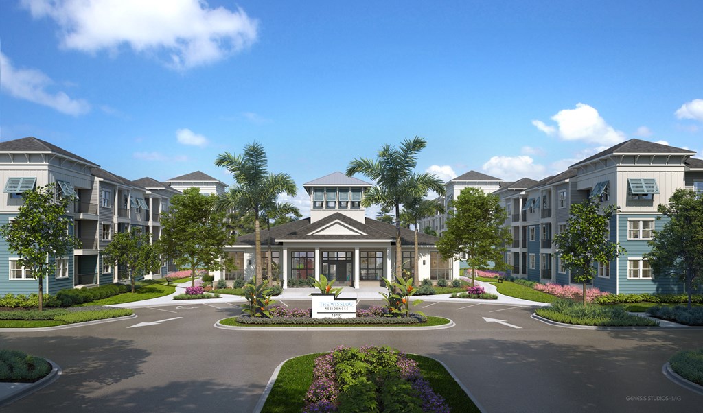 A large building with a circular driveway in front of it.