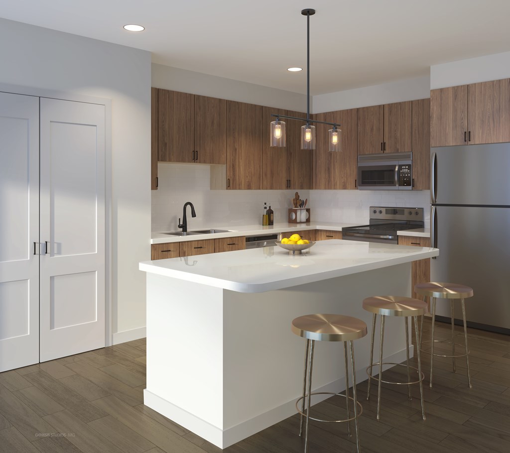 A modern kitchen with a white island and stools.