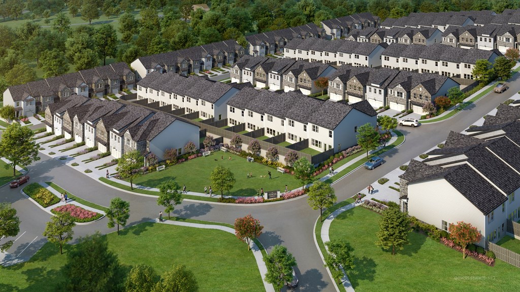 A large, well-maintained housing development with a variety of houses and landscaping.