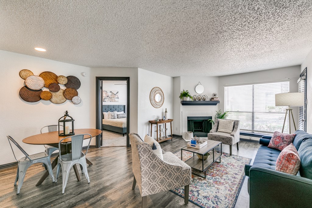 a living room with a couch and a table and a fireplace