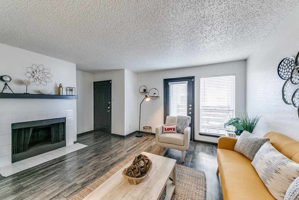 a living room with a fireplace and a couch