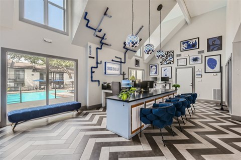 a dining room with a long bar and a large window