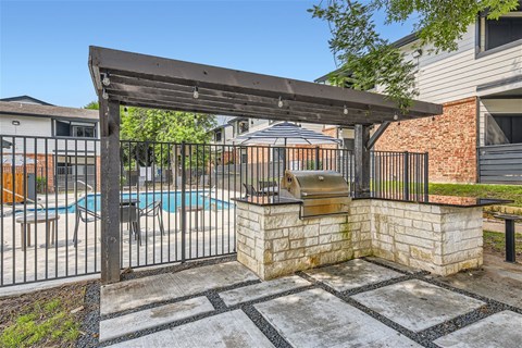 our apartments have a pool and a patio with a grill