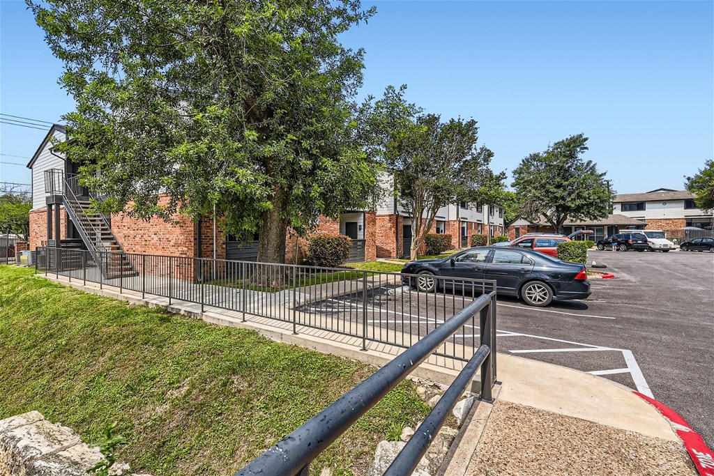 a car parked in a parking lot in front of a building